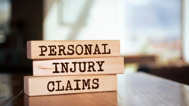 Wooden blocks with words ‘Personal injury claims’.