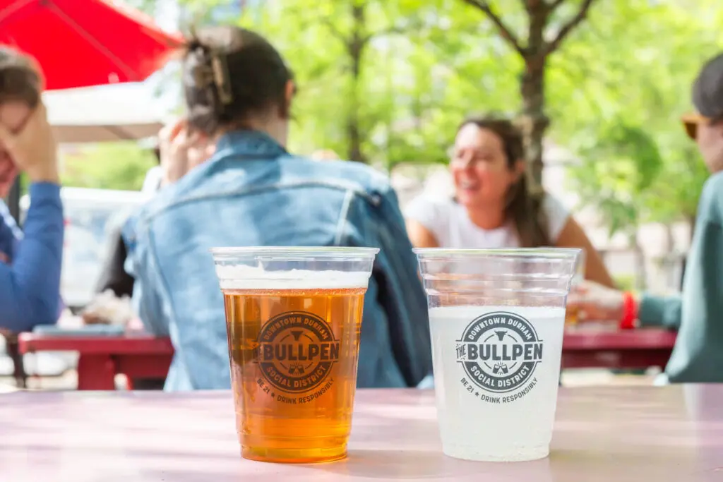 Two bullpen beverages in bullpen cups in downtown durham