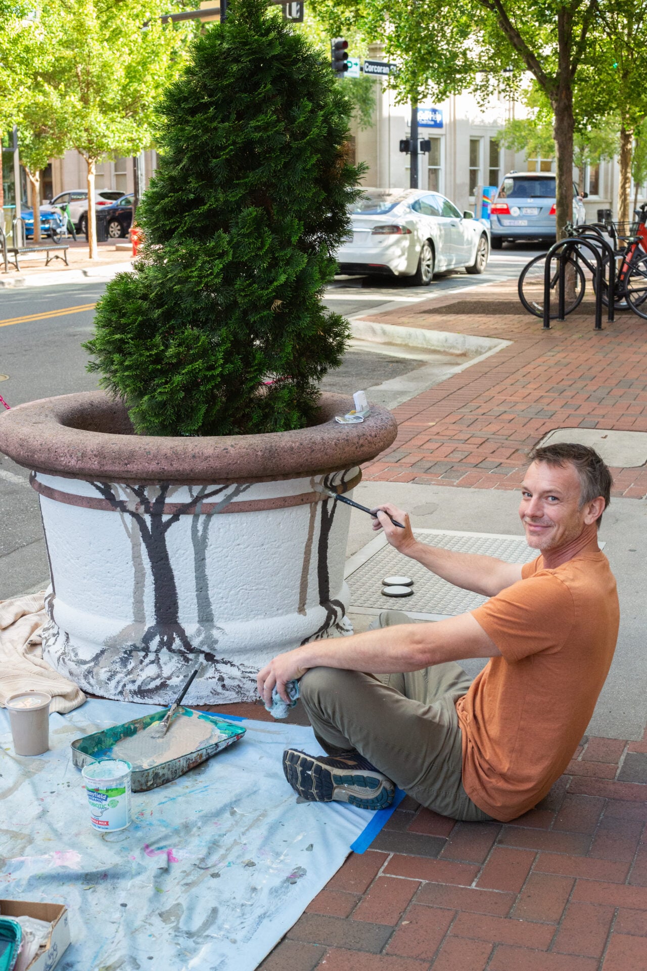 Artist painting a planter